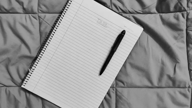 Spiral notebook and pen ready for a checklist